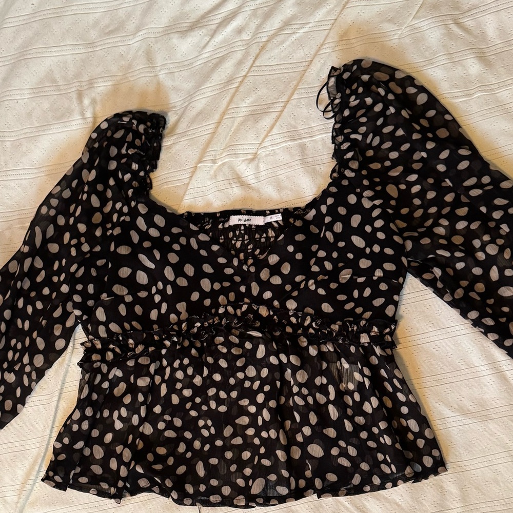Black and White Puff Sleeve Blouse with Ruffled Fitted Style